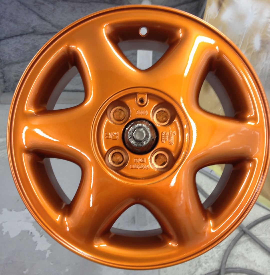 Alloy wheel refurbished in a solid colour finish